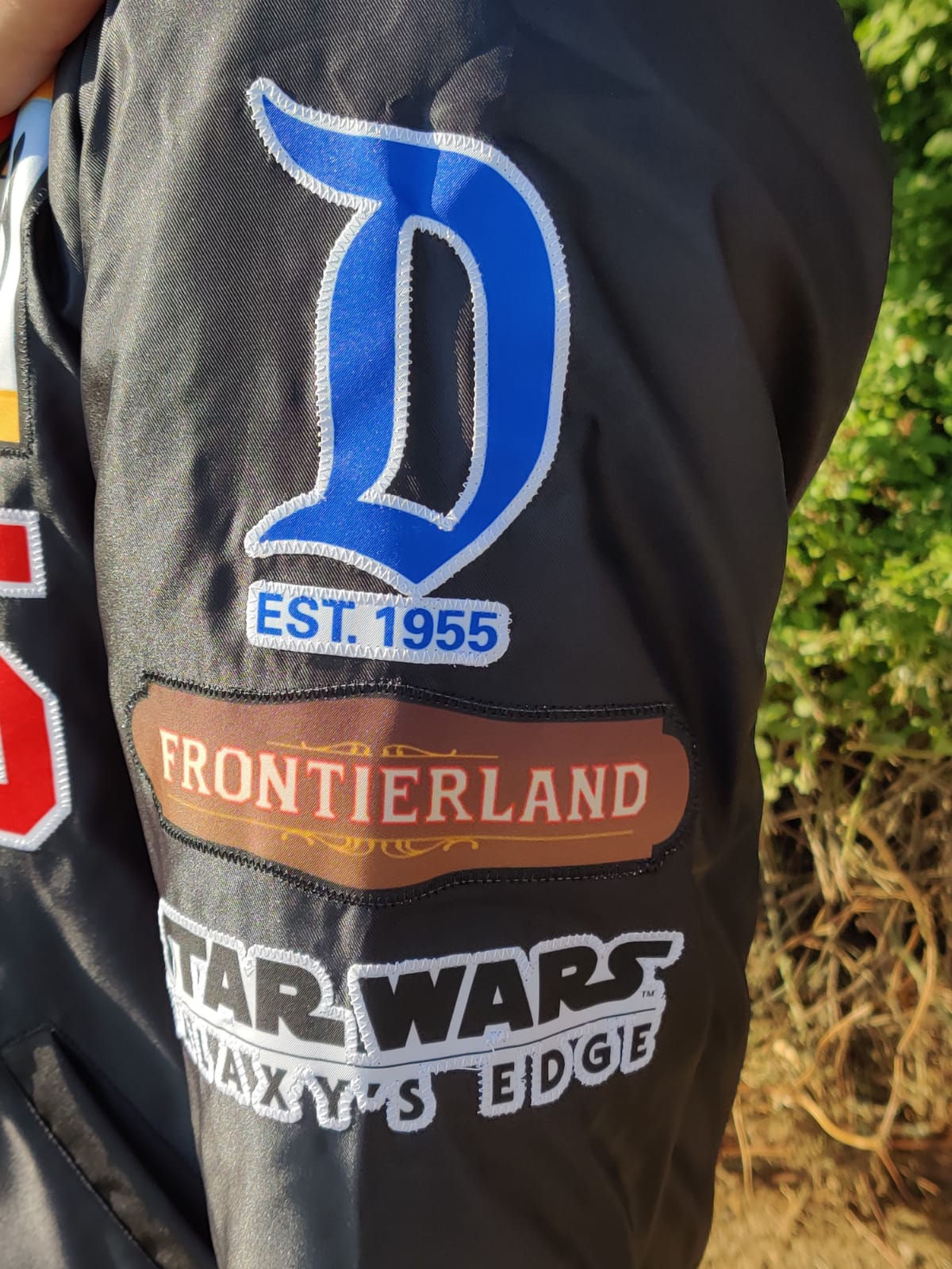 a Disneyland Sign Jacket w/stitched patches.